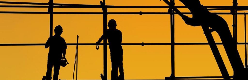 Construction workers in silhouette